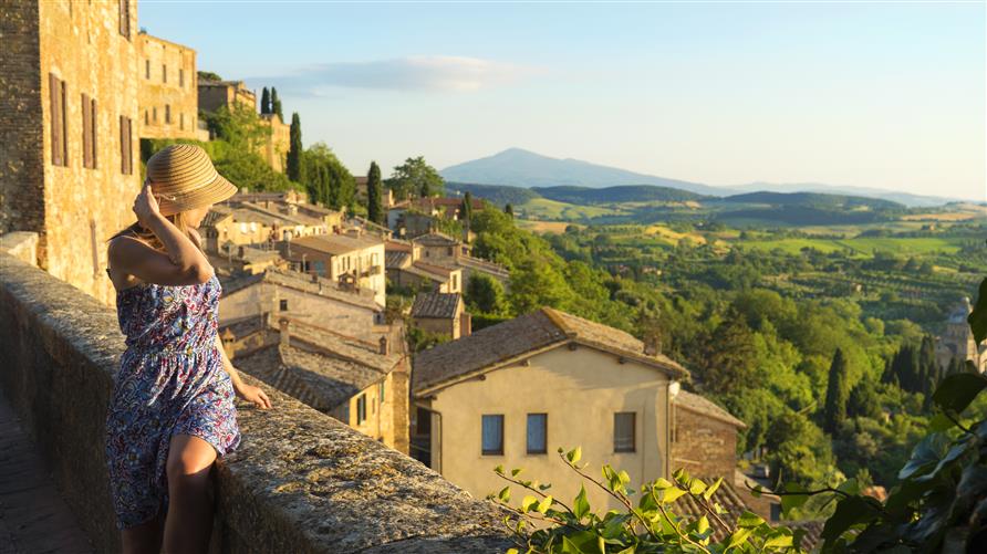 Woman overlook view, Tuscany, Italy