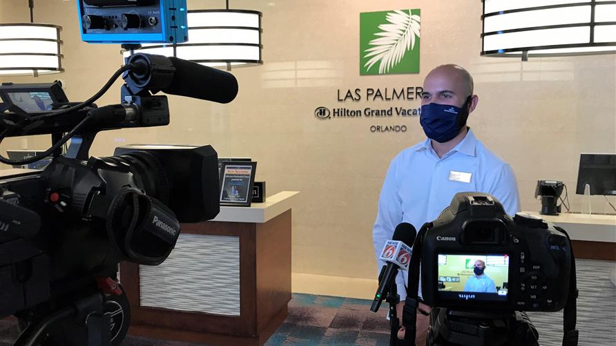 Hilton Grand Vacations Orlando Team Member being interview by News 6 in Orlando after being honored for saving Owners life. 