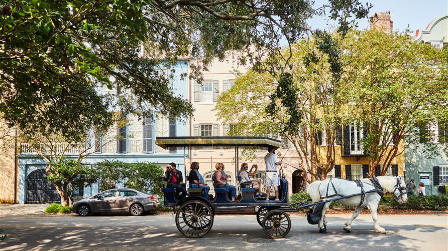 Tourists on a horse and carriage tour in Charleston, South Carolina. 