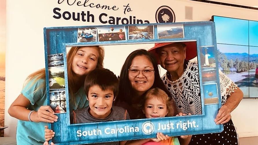 Hilton Grand Vacations Explorer and family posing for a multigenerational picture in Charleston, South Carolina. 