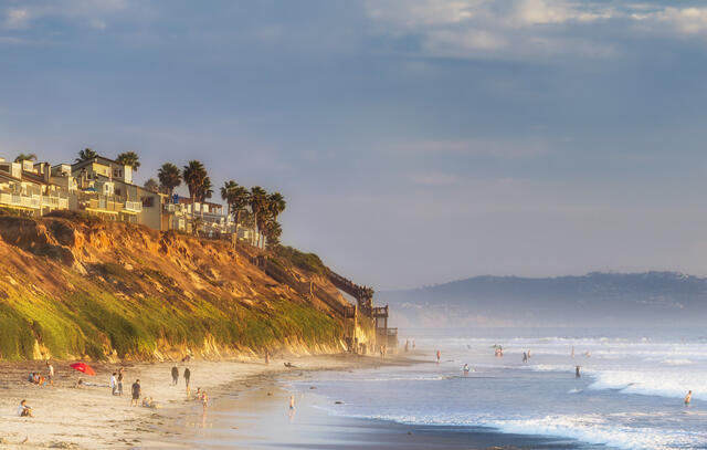 Picturesque shot of beach goers on a Carlsbad, California beach. 