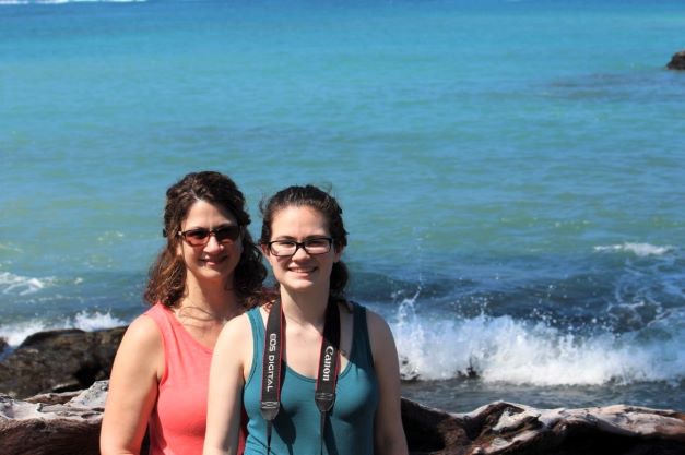 Hilton Grand Vacations Owner Gina P. and her family posing by the ocean 