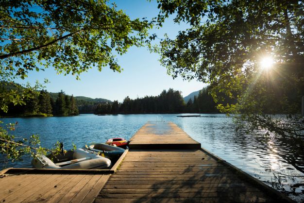Dock with kayaks at Alpha Lake near Whistler, Canada, in summer