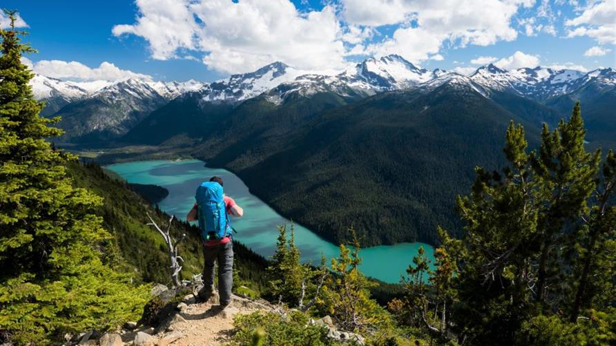 A hiker overlooking the mountains near Whistler, Canada