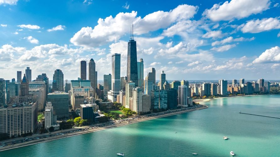 Stunning aerial image, Chicago skyline, clear blue skies, Lake Michigan shoreline, Illinois. 