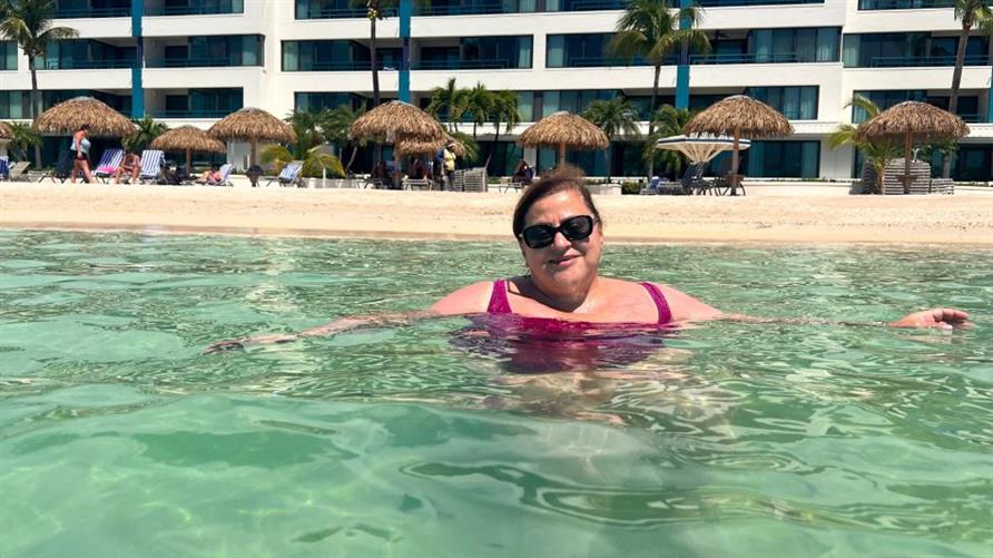 A Hilton Grand Vacations Member enjoying the pool at Royal Palm, a Hilton Vacation Club in Sint Maarten
