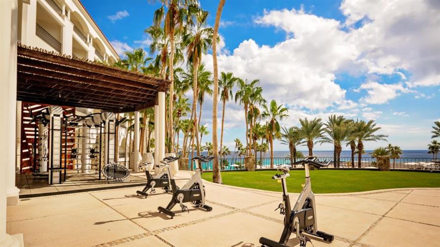 Exercise bikes on the patio of the fitness center of La Pacifica Los Cabos, a Hilton Club in Mexico