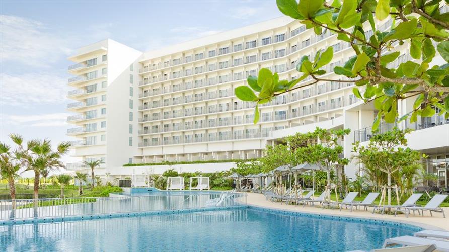 Pool and exterior of The Beach Resort Sesoko, a Hilton Club in Okinawa, Japan