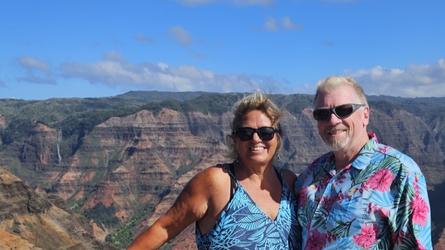 Hilton Grand Vacations Members posing by Waimea Canyon in Kauai, Hawaii