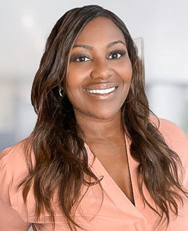 A headshot of Rashida, a Hilton Grand Vacations Member