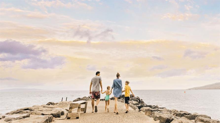 A family enjoying the sunset in Maui, Hawaii