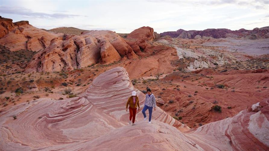 Two Hilton Grand Vacations Members hiking through Valley of Fire State Park near Las Vegas