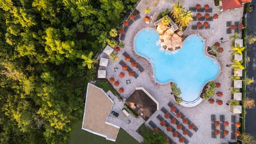 Aerial image overlooking pool and surrounding grounds at Mystic Dunes, a Hilton Vacation Club in Orlando, Florida
