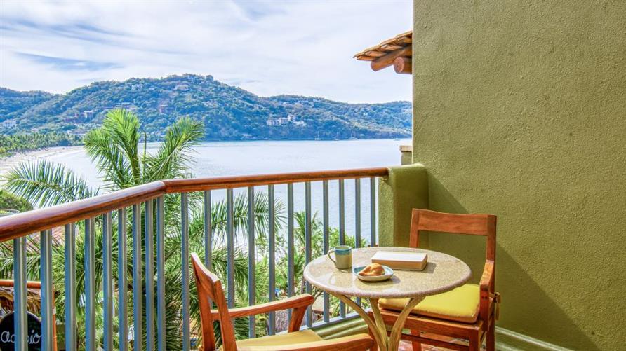 A table on a balcony of a Suite at Hilton Grand Vacations Club Zihuatanejo in Mexico