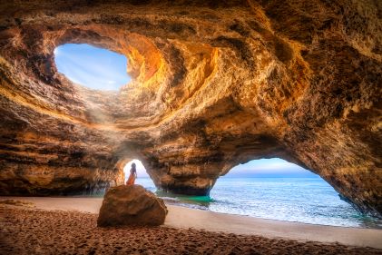 Sun streaming through Benagil Cave, Portugal. 