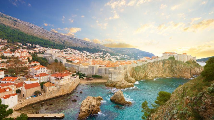 Stunning aerial view, European architecture along coastal cliffs, sunrise, Croatia.  