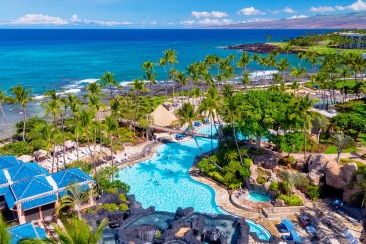 Aerial view of a winding swimming pool in a tropical locale