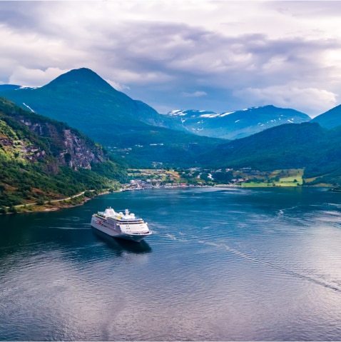 Ship in a bay surrounded by mountains