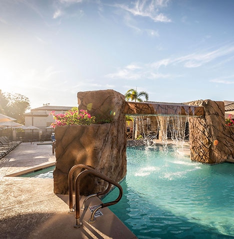 Pool with waterfall at Scottsdale Villa Mirage, located in Scottsdale, Arizona.