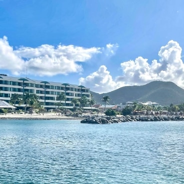View from a sailboat of the Royal Palm across the Caribbean waters.