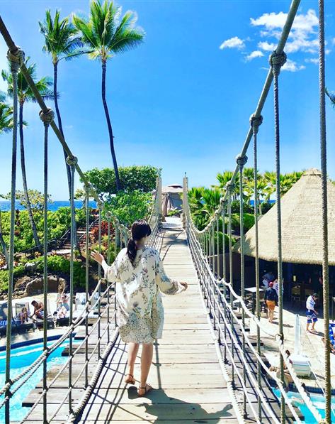Rope bridge over pool at Ocean Tower resort in Hawaii