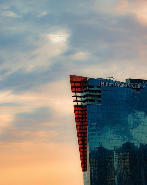 Elara, a Hilton Club, silhouetted in the sunset.