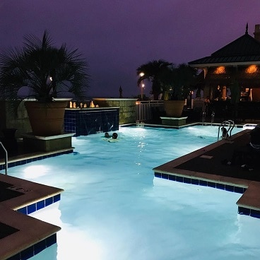Pool at Ocean Beach Club at sunset.