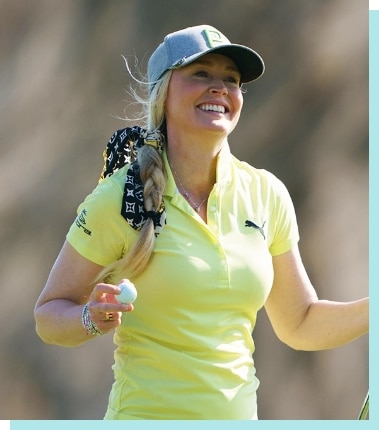 Golfer holding a golf ball.