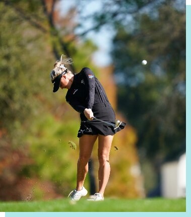 Woman golfing