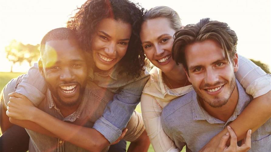 A group photo of two couples smiling. 